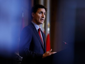 Canada's Prime Minister Justin Trudeau attends a news conference on the federal government's response to Hurricane Fiona, which was later downgraded to a posttropical storm, September 26, 2022 in Ottawa.