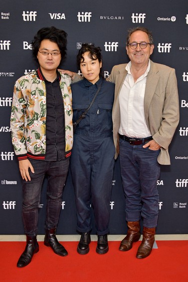 From left to right, Davy Chou, Park Ji-min, and Michael Barker attend the "Return To Seoul" Premiere during the 2022 Toronto International Film Festival at TIFF Bell Lightbox in Toronto, Sept. 8, 2022.