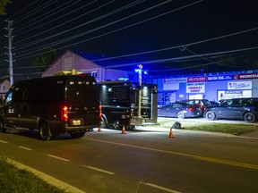 Halton Regional Police at the scene of a deadly triple shooting at a mechanics garage in Milton on Monday September 12, 2022.
