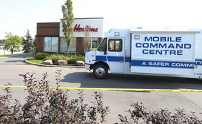 A Peel Regional Police command vehicle sits outside of a Tim Hortons off of Argentia Rd. in Mississauga where Toronto Police Const. Andrew was shot to death on Thursday, Sept. 15, 2022.