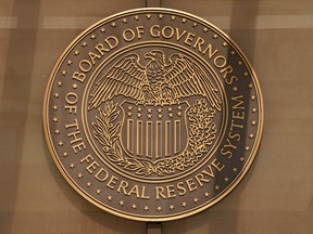 A sign for the Federal Reserve Board of Governors is seen at the entrance to the William McChesney Martin Jr. building in Washington, September 21, 2022.