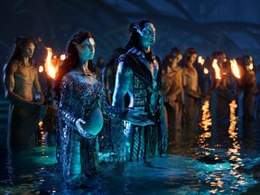 Kate Winslet, left, and Cliff Curtis play members of the Metkayina, a Na’vi clan, in Avatar: The Way of Water.