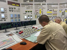 Employees work at the Russian-controlled Zaporizhzhia Nuclear Power Plant during a visit by members of the International Atomic Energy Agency (IAEA) expert mission, in the course of Ukraine-Russia conflict outside Enerhodar in the Zaporizhzhia region, Ukraine, in this picture released Sept. 2, 2022.