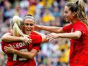 Canada's Adriana Leon (L) celebrates with teammates after scoring a goal during the women's friendly football match between Australia and Canada in Brisbane on September 3, 2022.