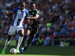 Brighton's English striker Danny Welbeck (L) fights for the ball with Leicester City's Ghanaian midfielder Daniel Amartey during the English Premier League football match between Brighton and Hove Albion and Leicester City at the American Express Community Stadium in Brighton, southern England on September 4, 2022.