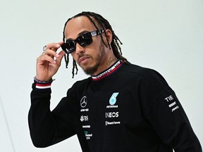 Mercedes' British driver Lewis Hamilton arrives at the press conference at the Autodromo Nazionale circuit in Monza on September 8, 2022 ahead of the Italian Formula One Grand Prix.
