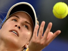Eugenie Bouchard of Canada tosses a ball to serves against Joanne Zuger (not pictured) of Switzerland during Chennai open tennis tournament in Chennai on September 12, 2022.