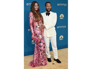 John Legend and Chrissy Teigen arrive for the 74th Emmy Awards at the Microsoft Theater in Los Angeles, Calif., on Sept. 12, 2022.