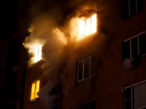 A woman has been chaged with four counts of second-degree murder and was also indicted on multiple assault charges following an apartment fire in Worcester, Mass., in May.