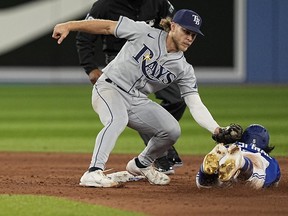Sep 14, 2022; Toronto, Ontario, CAN; Tampa Bay Rays shortstop Taylor Walls (0) catches Toronto Blue Jays second baseman Santiago Espinal (5) trying to steal second base during the sixth inning at Rogers Centre.