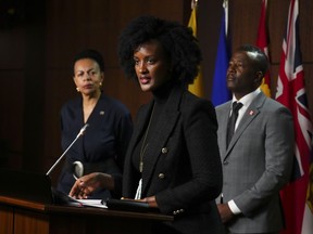 Ketty Nivyabandi, secretary-general of Amnesty International Canada speaks as she joins the Black Class Action Secretariat as they hold a press conference on Parliament Hill in Ottawa on Wednesday, Sept. 28, 2022.