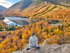 A hiker stops at Artist’s Bluff in New Hampshire’s Franconia Notch State Park.