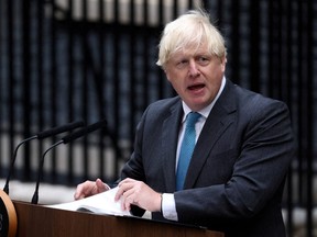 Outgoing British Prime Minister Boris Johnson delivers a speech on his last day in office, outside Downing Street, in London, Sept. 6, 2022.