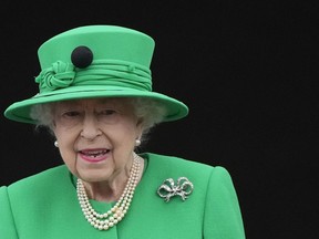 Queen Elizabeth II stands on the balcony during the Platinum Jubilee Pageant at the Buckingham Palace in London, Sunday, June 5, 2022, on the last of four days of celebrations to mark the Platinum Jubilee.