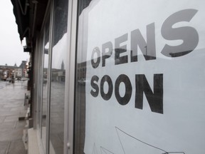 A sign announces a store will open soon on April 30, 2020 in Ottawa.