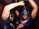 Bo Bichette and Vladimir Guerrero Jr. of the Toronto Blue Jays celebrate clinching a playoff spot after beating the Boston Red Sox at Rogers Centre on September 30, 2022 in Toronto.
