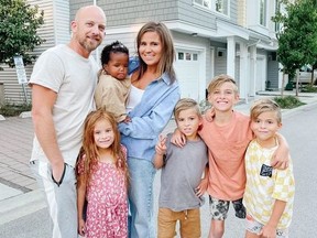 Vanessa van Tol and her husband Jordan pose for a photo with their children Malaya, 6, baby Reamohetse, Maverick, 8, Cruz, 10, and Roan, 8, in this undated handout photo.