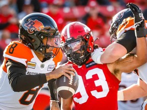 BC Lions quarterback Vernon Adams throws under pressure from Romeo McKnight of the Calgary Stampeders during CFL football in Calgary on Saturday, September 17, 2022.