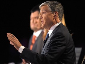 Debate moderator moderator John Harwood asks a question during the CNBC Republican presidential debate at the University of Colorado, Oct. 28, 2015, in Boulder, Col.