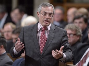 Treasury Board President Tony Clement answers a question during Question Period in the House of Commons in Ottawa, Tuesday, May 26, 2015.