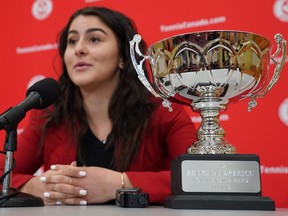 The Lou Marsh Trophy is seen in the foreground as Bianca Andreescu speaks to reporters during a media availability in Toronto, Tuesday, Dec. 10, 2019.