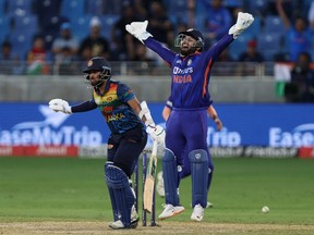 Cricket - Asian Cup - India v Sri Lanka - Dubai International Cricket Stadium, Dubai, United Arab Emirates - September 6, 2022. Sri Lanka's Kusal Mendis and India's Rishabh Pant react.