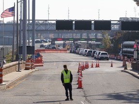 Vehicles wait to enter the U.S. at the Thousand Islands border crossing in Lansdowne, Ont., Monday Nov. 8, 2021.