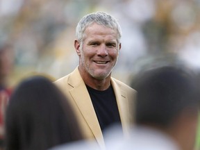 In this Oct. 16, 2016, file photo, Hall of Fame quarterback Brett Favre is shown during a halftime ceremony of an NFL football game against the Dallas Cowboys, in Green Bay, Wis.