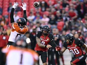 Ottawa Redblacks quarterback Jeremiah Masoli (8) throw the ball past the reach of BC Lions defensive back Loucheiz Purifoy (0) during first half CFL football action in Ottawa on Thursday, June 30, 2022.
