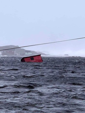 This Sept. 24, 2022, image courtesy of Michael King, special advisor to Newfoundland and Labrador Premier Andrew Furey, and his family, shows damaged caused by post-tropical storm Fiona on the Burnt Islands in Newfoundland and Labrador.