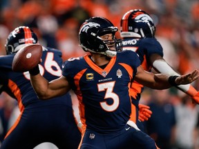 Sep 25, 2022; Denver, Colorado, USA; Denver Broncos quarterback Russell Wilson (3) attempts a throw in the fourth quarter against the San Francisco 49ers at Empower Field at Mile High.