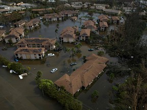 An aerial picture taken on September 29, 2022 shows a flooded neighborhood in the aftermath of Hurricane Ian in Fort Myers, Florida.