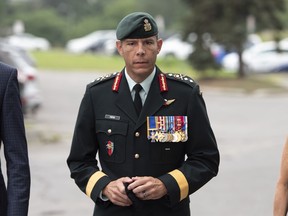 Maj.-Gen. Dany Fortin arrives to be processed at the Gatineau Police Station in Gatineau, Que., on Wednesday, Aug. 18, 2021.