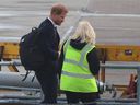 Prince Harry boards a plane at Aberdeen International Airport, following the passing of Queen Elizabeth, in Aberdeen, Britain, Sept. 9, 2022.