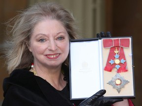 Hilary Mantel holds her Dame Commander of the British Empire medal presented to her by the Prince of Wales for services to literature at an Investiture ceremony at Buckingham Palace on Feb. 6, 2015 in London.