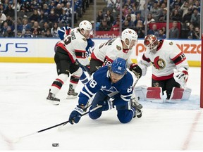 Sep 24, 2022; Toronto, Ontario, CAN; Toronto Maple Leafs right wing William Nylander (88) battles for a puck with Ottawa Senators defenseman Erik Brannstrom (26) during the first period at Scotiabank Arena.