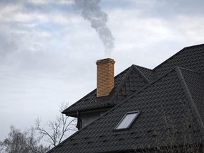 A new report estimates the cost of making residential homes carbon neutral by 2050 would be up to $18,000 for a single, detached home.