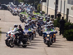 An estimated 8,000 police officers and others took part in Wednesday's funeral for Toronto Police Const. Andrew Hong