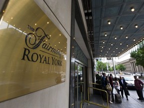 Doormen work at the Royal York Hotel in Toronto on Thursday, June 3, 2010. Real estate firm CBRE says Canadian hotels will return to pre-pandemic revenues next year, two years ahead of its previous forecast.