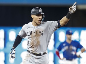 Aaron Judge of the New York Yankees runs the bases as he hits his 61st home run of the season against the Toronto Blue Jays at Rogers Centre on September 28, 2022.