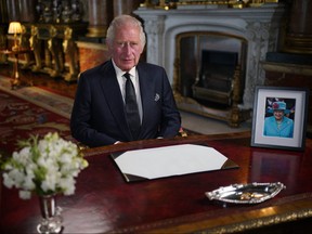 King Charles III makes a televised address to the Nation and the Commonwealth from the Blue Drawing Room at Buckingham Palace in London on Sept. 9, 2022, a day after Queen Elizabeth II died at the age of 96.