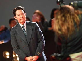 South Korean actor and director Lee Jung-jae arrives for the premiere of “Hunt” during the Toronto International Film Festival at the Roy Thompson hall in Toronto, on Sept. 15, 2022.