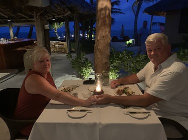 Chris Doucette and his wife Pam enjoy a romantic moonlit dinner at Matachica Resort and Spa's Mambo Restaurant during a trip to Belize in August 2022.