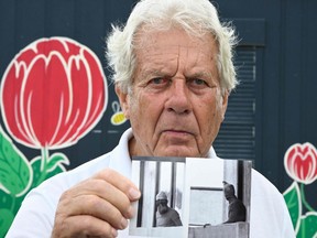Former handball player Klaus Langhoff, who witnessed the 1972 Munich Olympics hoastage-taking, shows one of his pictures during an AFP interview in Rostock, northeastern Germany, on Aug. 25, 2022.
