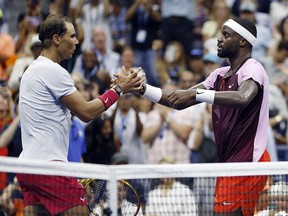Frances Tiafoe shakes hands after defeating Rafael Nadal during their match at the 2022 U.S. Open at USTA Billie Jean King National Tennis Center on September 5, 2022