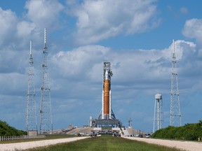 In this handout image courtesy of NASA the NASAs Space Launch System (SLS) rocket with the Orion spacecraft aboard is seen atop the mobile launcher at Launch Pad 39B as teams configure systems for rolling back to the Vehicle Assembly Building, Sept. 24, 2022, at NASAs Kennedy Space Center in Florida.