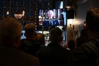 Drinkers in the Prince of Wales pub in central London watch a televised address by Britain's King Charles III, made from the Blue Drawing Room at Buckingham Palace in London on Sept. 9, 2022, a day after Queen Elizabeth II died at the age of 96. 