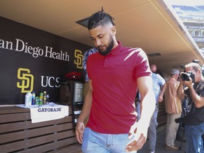 San Diego Padres' Fernando Tatis Jr. leaves a press conference about his 80 game suspension from baseball Tuesday, Aug. 23, 2022, in San Diego.
