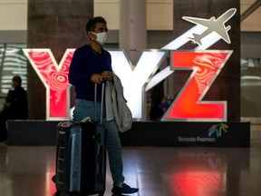 A passenger is pictured at Terminal 1 International Arrivals area at Toronto Pearson International Airport on Sept. 26, 2022.