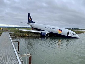 This handout picture obtained on Sept. 24, 2022 from the Bureau d'Enquetes et d'Analyses pour la Securite de l'Aviation Civile (BEA) shows an Aeropostale Boeing 737 aircraft after it overran the runway during its landing phase at night at Montpellier airport.